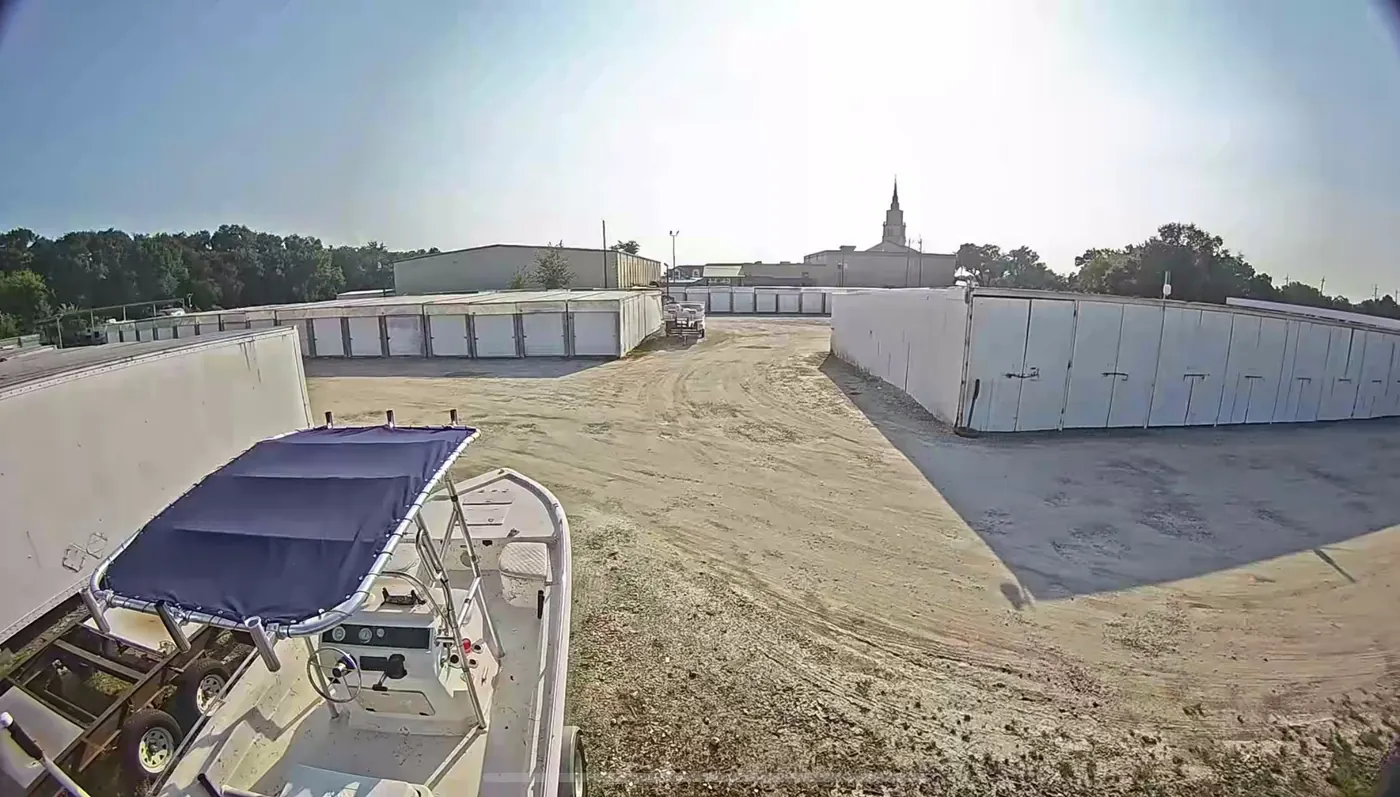 Boat parked in a stall with open lot space at Almeda Genoa Storage