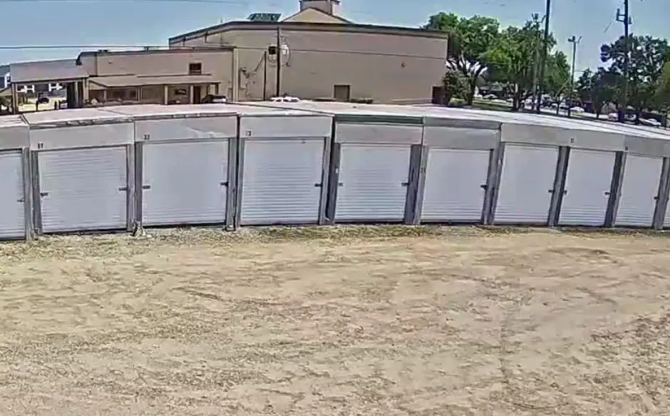 Row of covered storage stalls along the lot at Almeda Genoa Storage